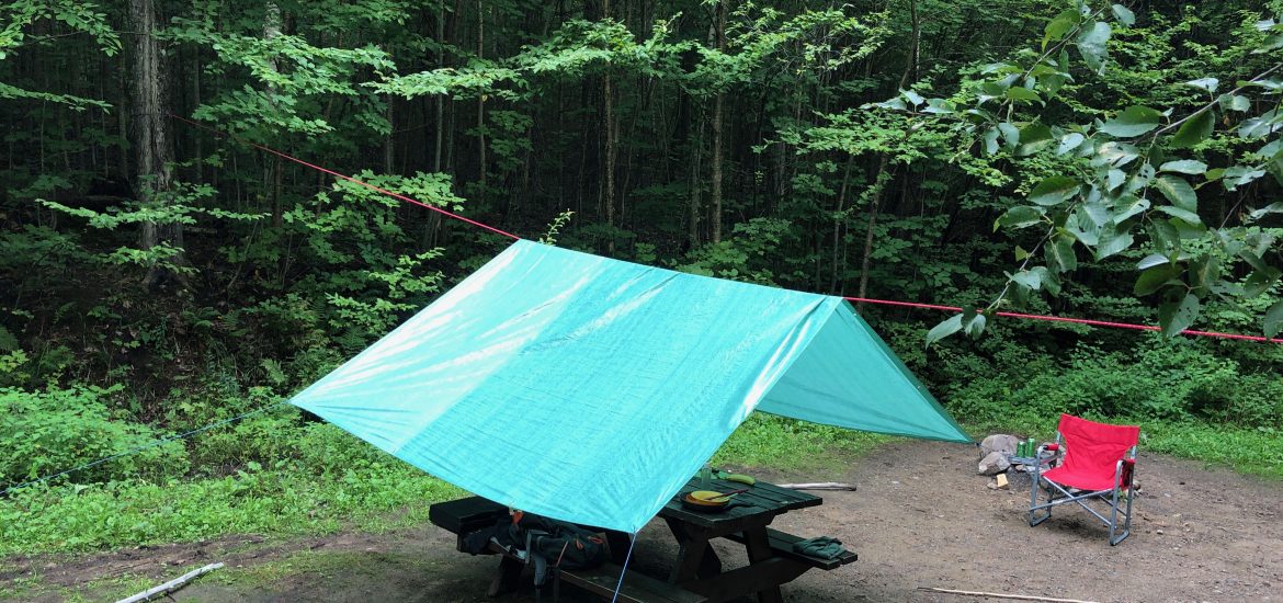 How to Properly Set Up a Tarp for Rain or Shade Over a Picnic Table