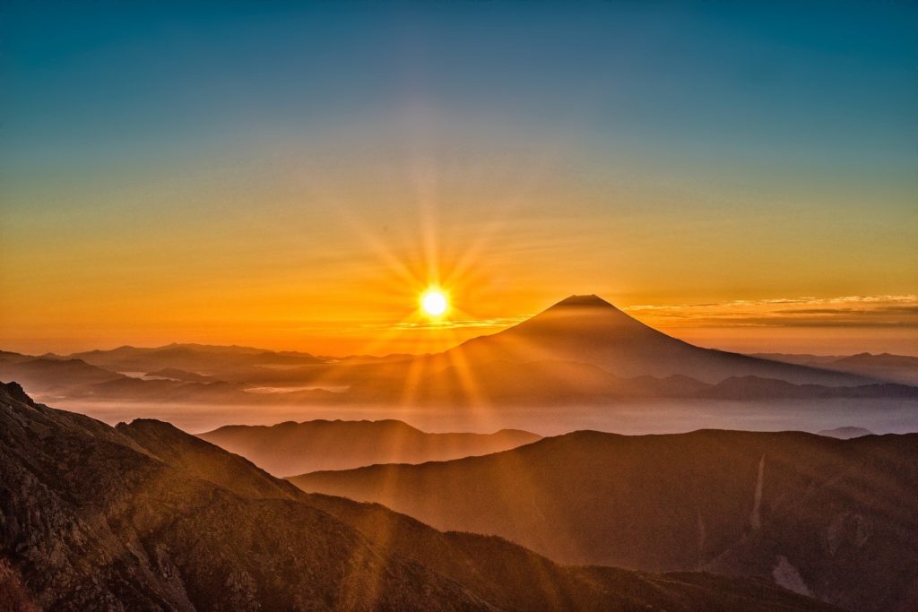 sun light mountain peaks high altitude UV climb